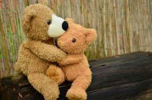 two teddy bears cuddling, comforting