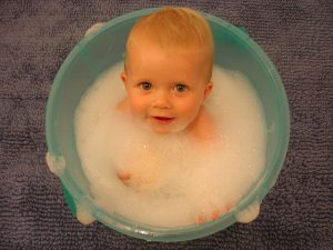 Baby in bath with bubbles
