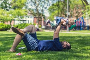 Dad paying outside with Baby, bond building