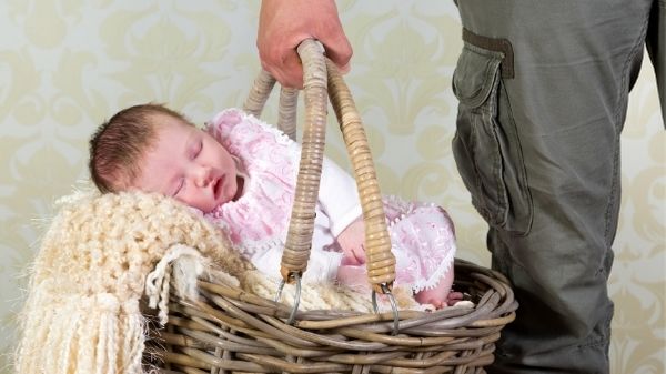 newborn in basket