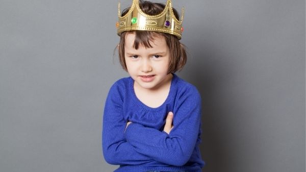 spoilt child wearing crown