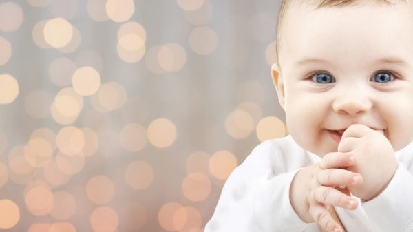 happy baby smiling at camera