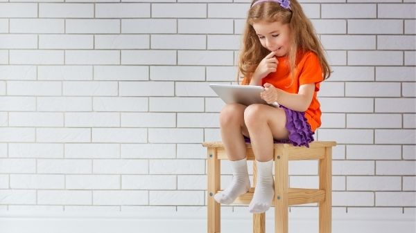 girl watching tablet - screen time