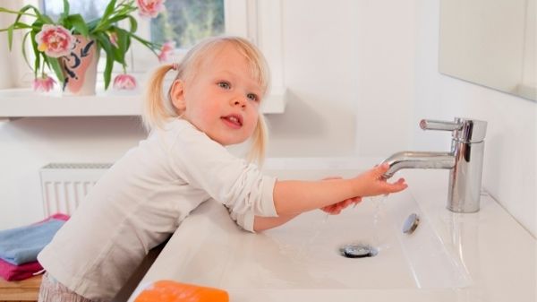 toddler washing hands