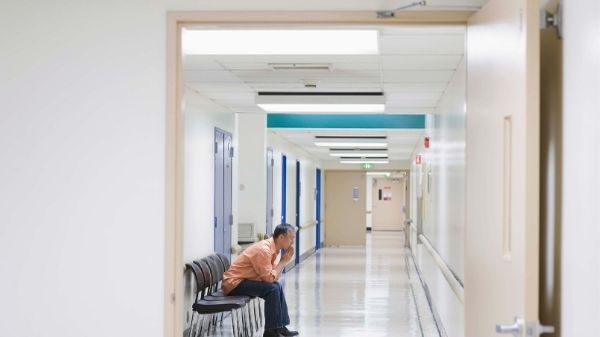 man sitting in hospital waiting