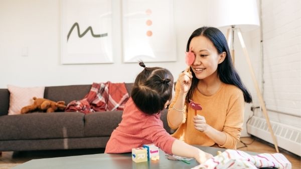 mom and toddler having fun playing