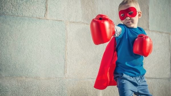 child with mask and boxing gloves on