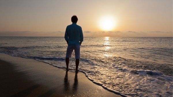 man alone on beach