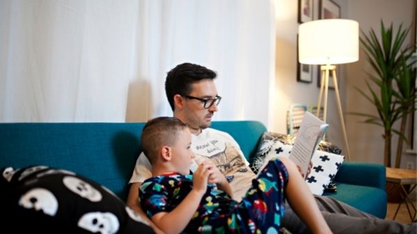 father reading to his son