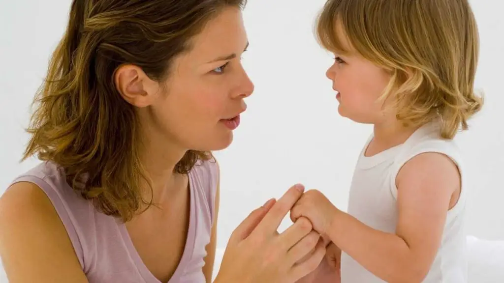 toddler showing empathy to her mom