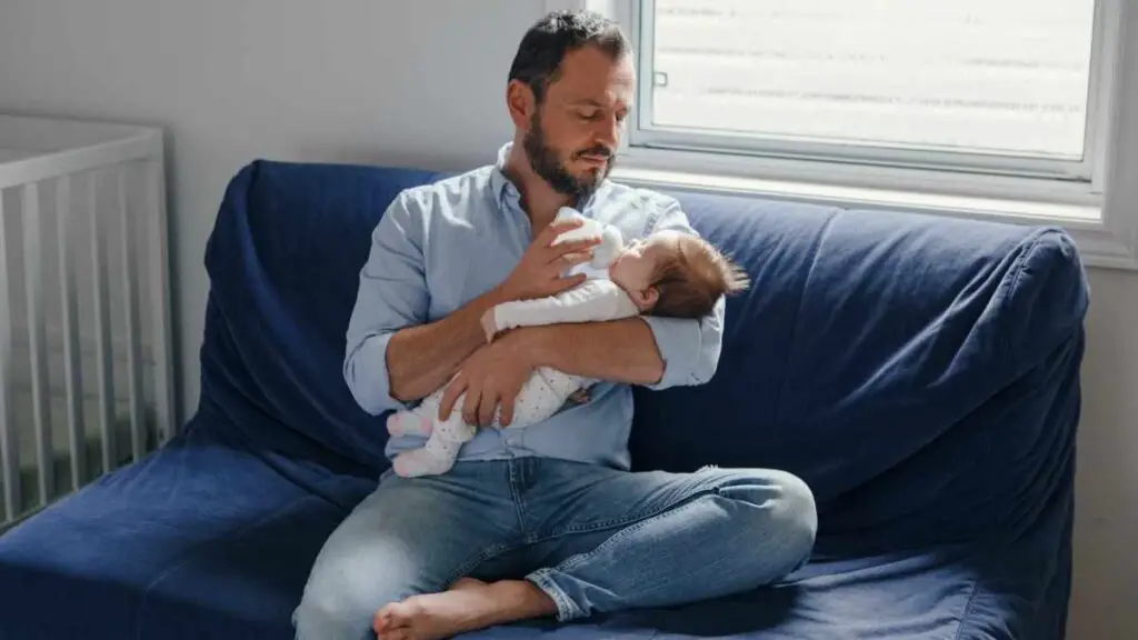 dad feeding baby