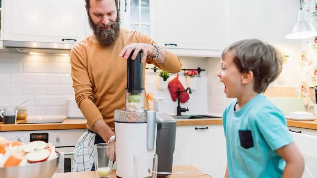 healthy man making son a healthy snack