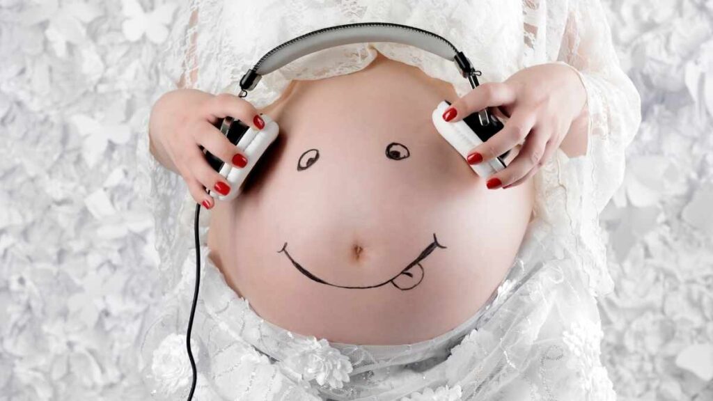 pregnant bump with headphones