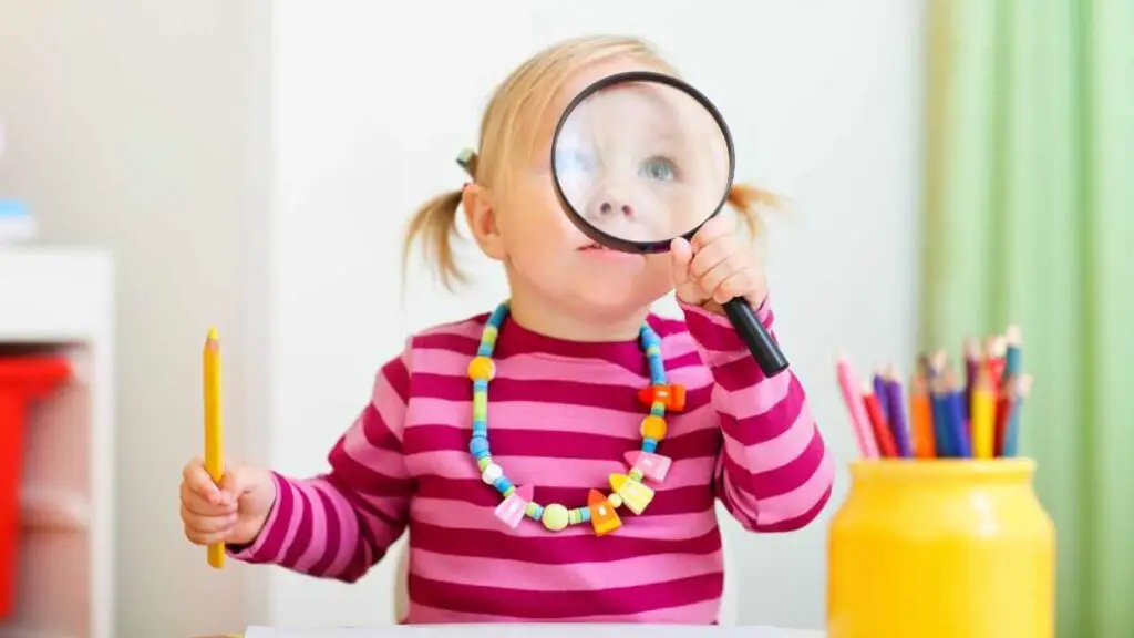 toddler looking through glass