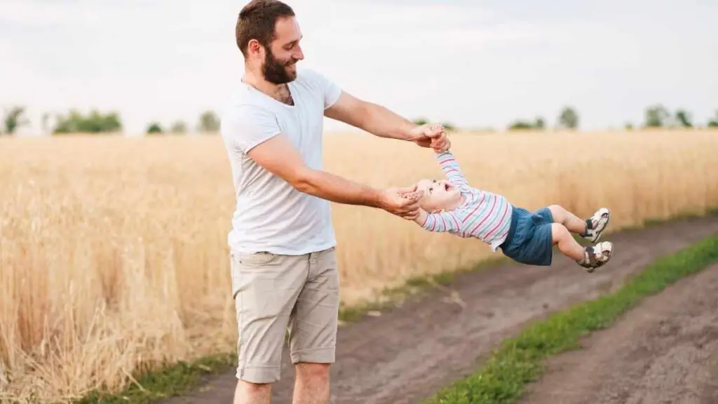 dad playing with toddler