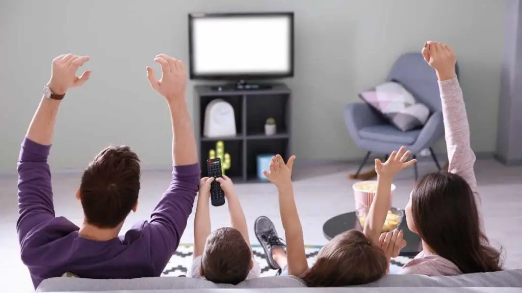 dad watching tv with toddler