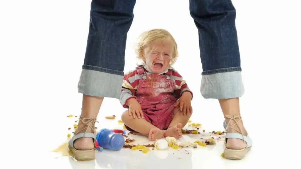 toddler crying between legs