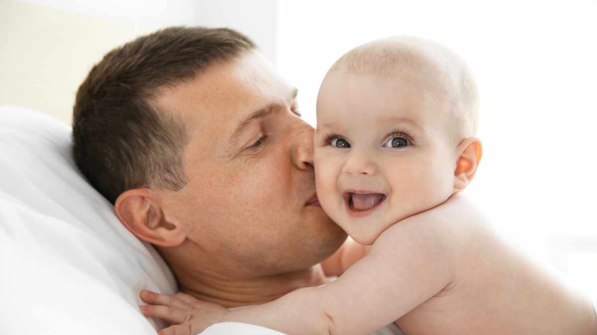 baby showing affection to parent