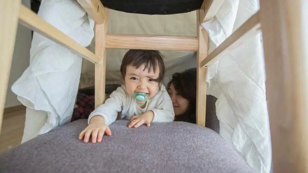 toddler in fort