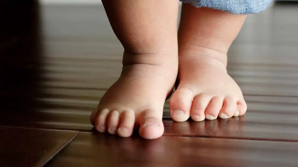 baby walking barefoot