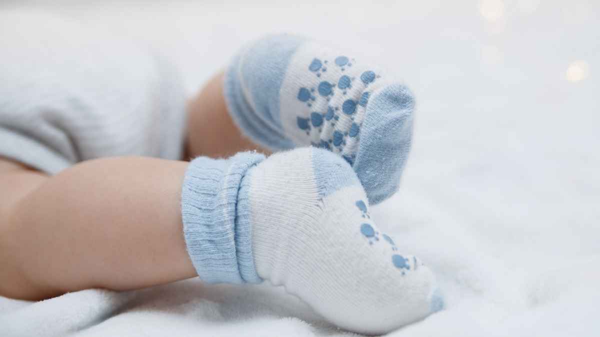 how to keep baby socks on- blue socks on a baby