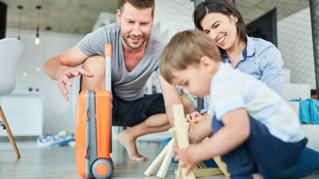 toddler playing with parents