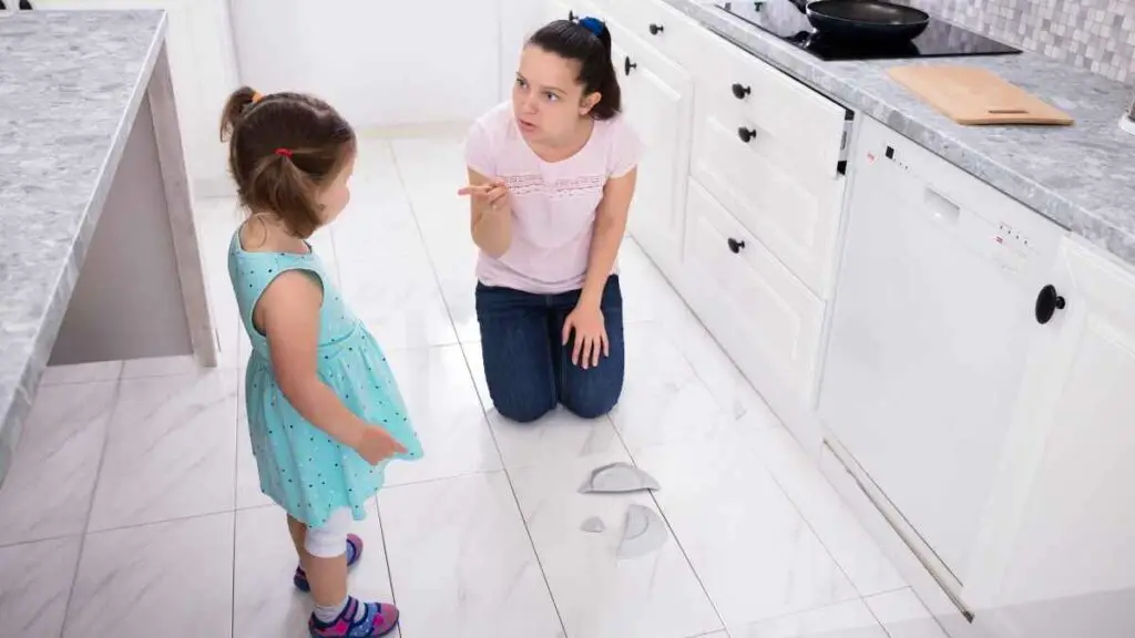 mom telling toddler off