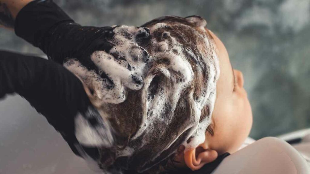 toddler having hair washed